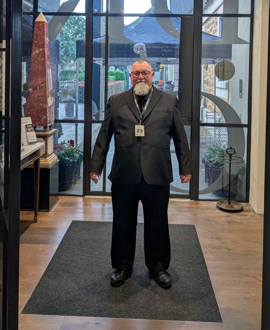 Concierge security guard providing professional lobby security services in Adelaide office building
